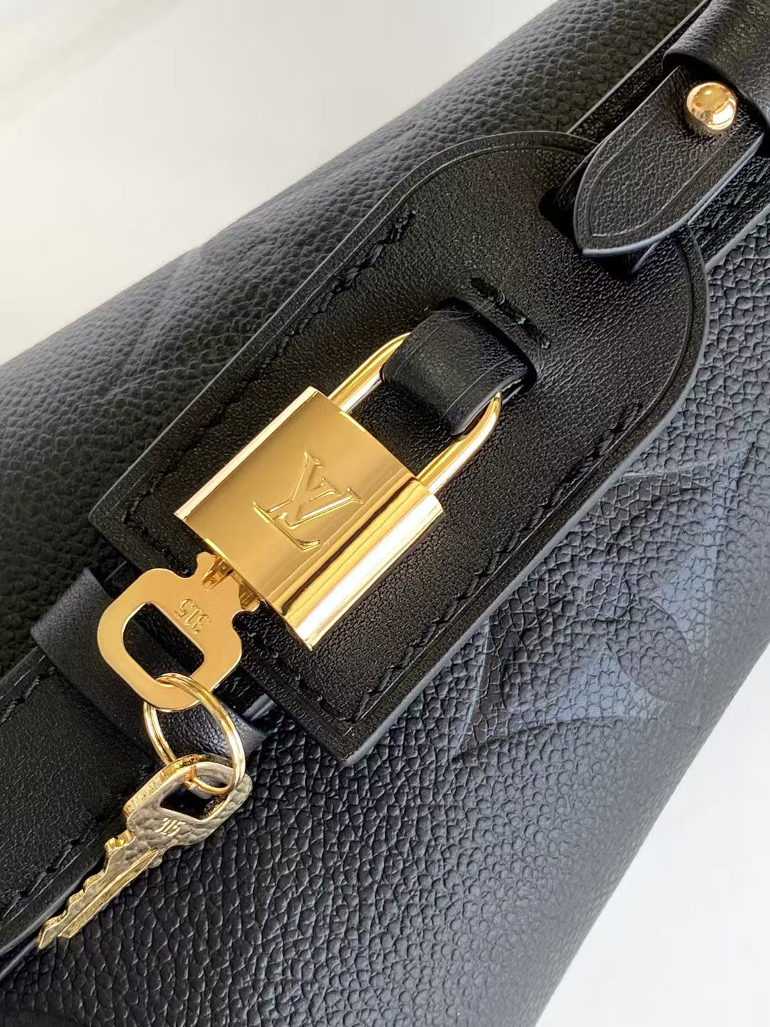 M40817 Bucket Shoulder Bag Monogram Embossed Black Color.