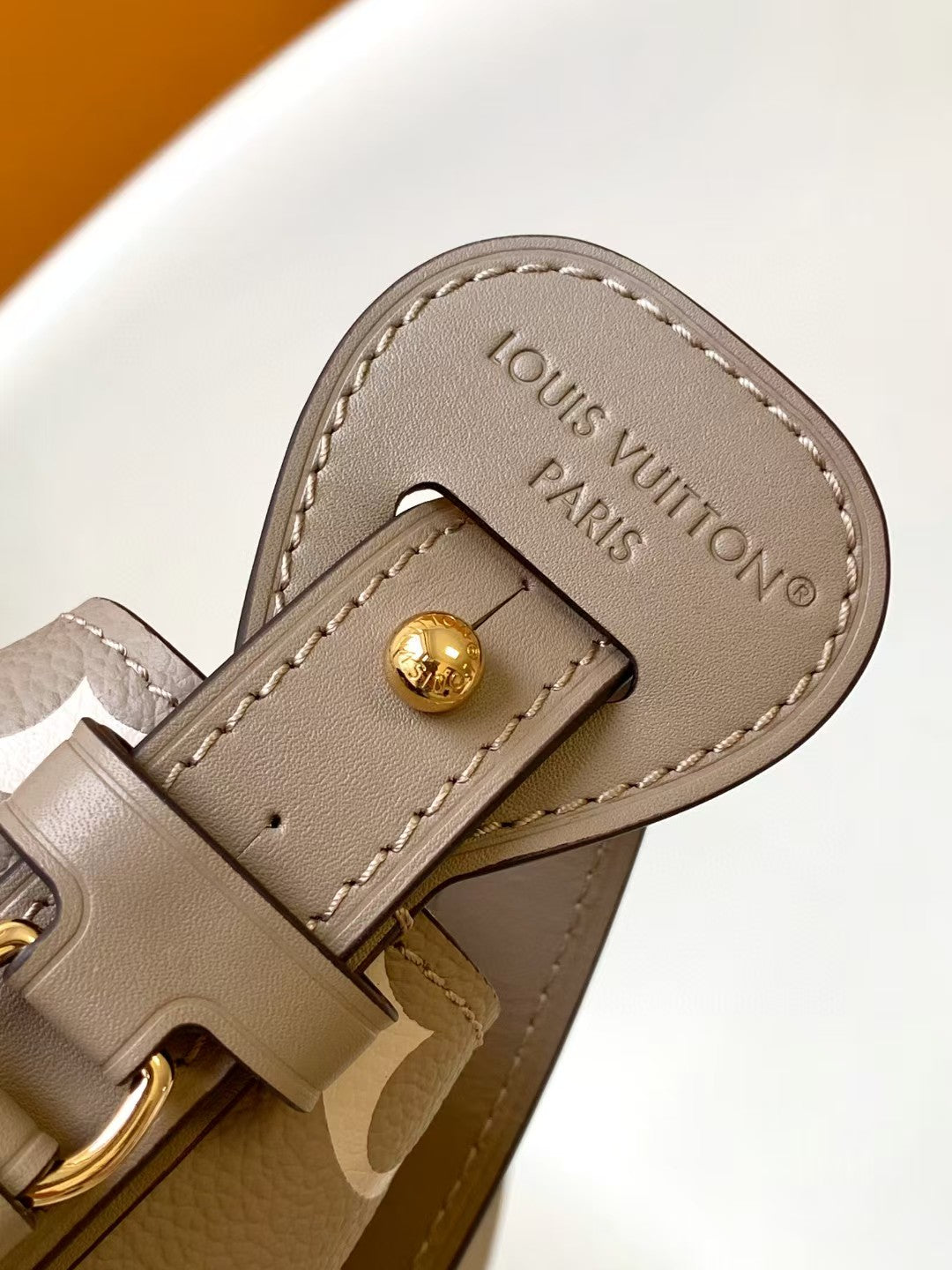 M40817 Bucket Shoulder Bag Monogram Embossed Grey Color.