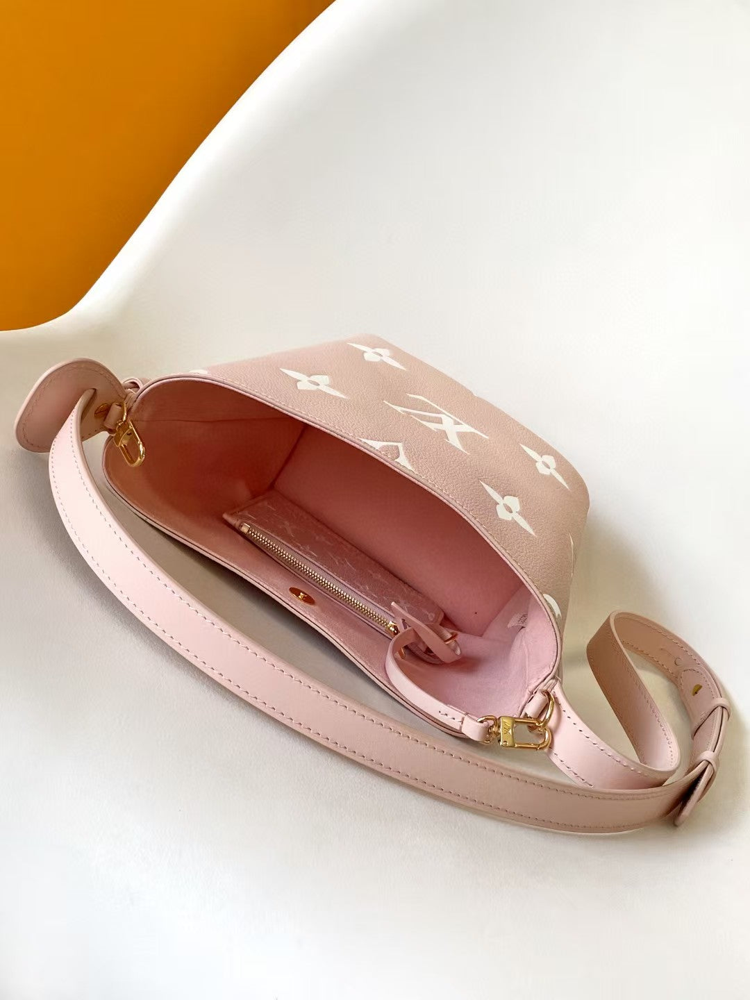 M44679 Bucket Shoulder Bag Monogram Embossed Pink Color.