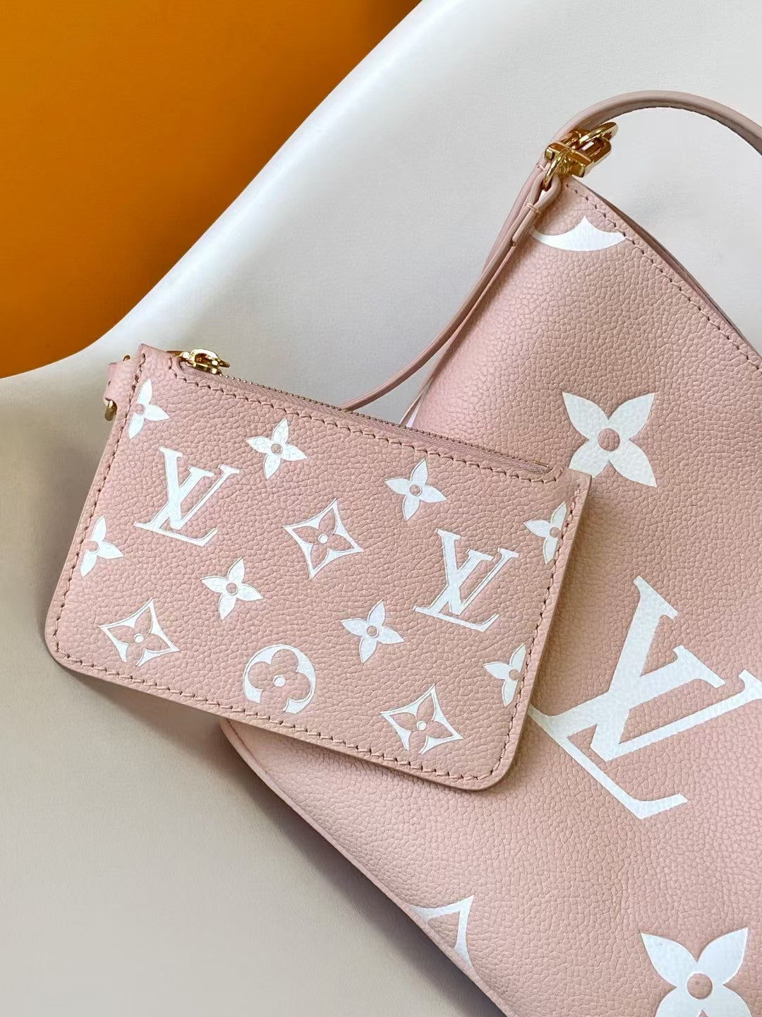 M44679 Bucket Shoulder Bag Monogram Embossed Pink Color.