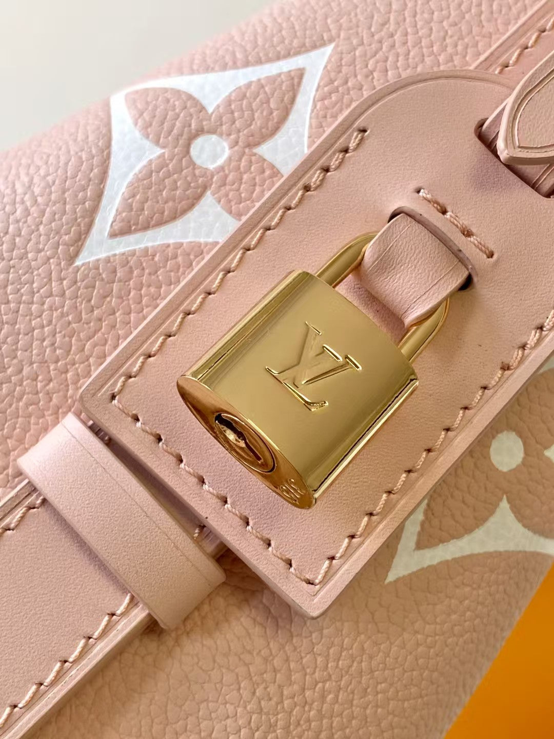 M44679 Bucket Shoulder Bag Monogram Embossed Pink Color.