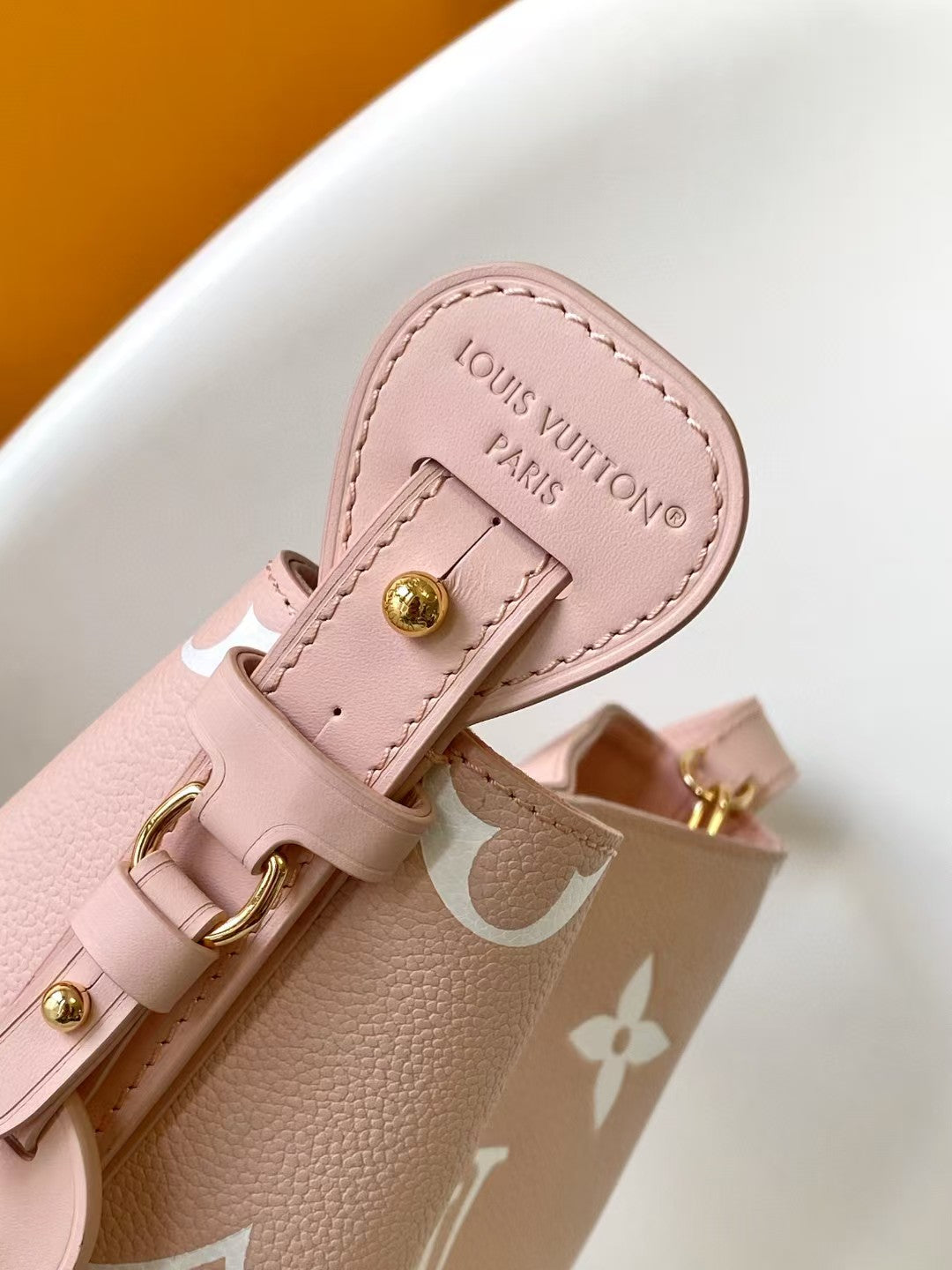 M44679 Bucket Shoulder Bag Monogram Embossed Pink Color.