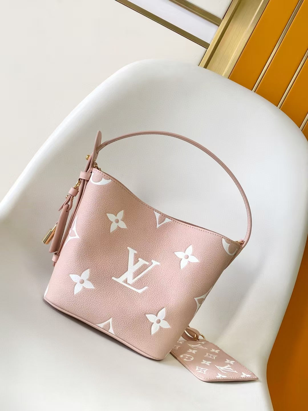 M44679 Bucket Shoulder Bag Monogram Embossed Pink Color.