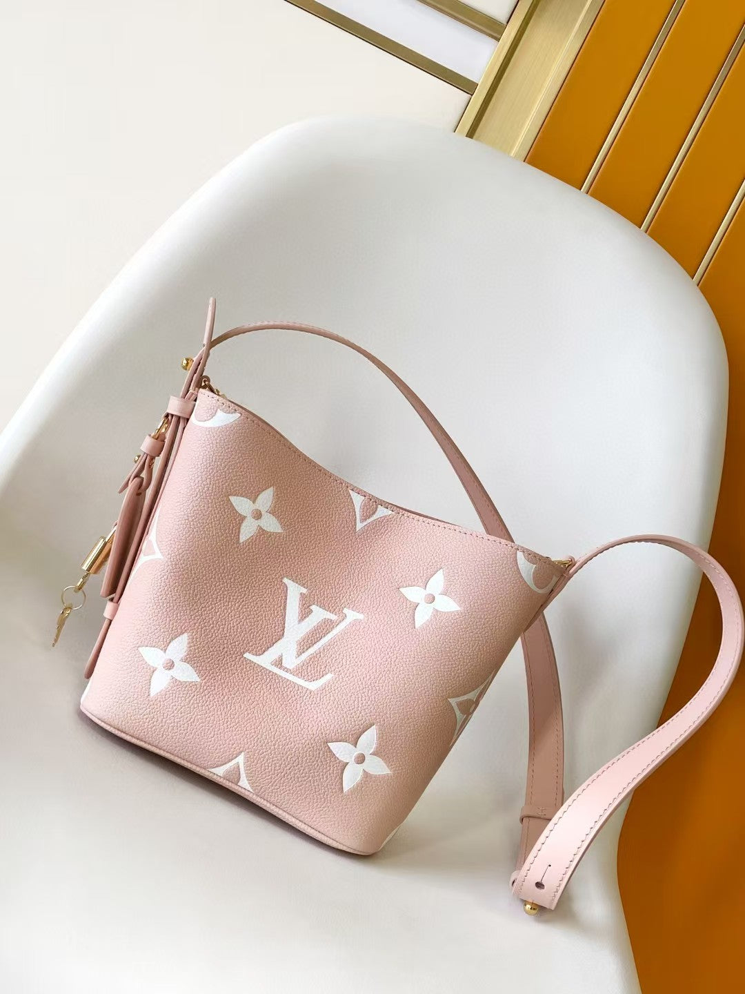 M44679 Bucket Shoulder Bag Monogram Embossed Pink Color.
